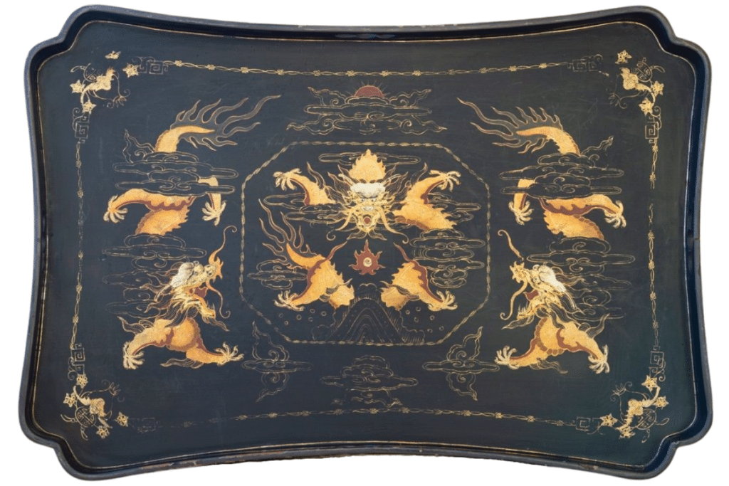 19th-century lacquered tray during the Qing dynasty. Three five-clawed dragons with the flaming pearl below the sun. The four bats in the corners are for prosperity.