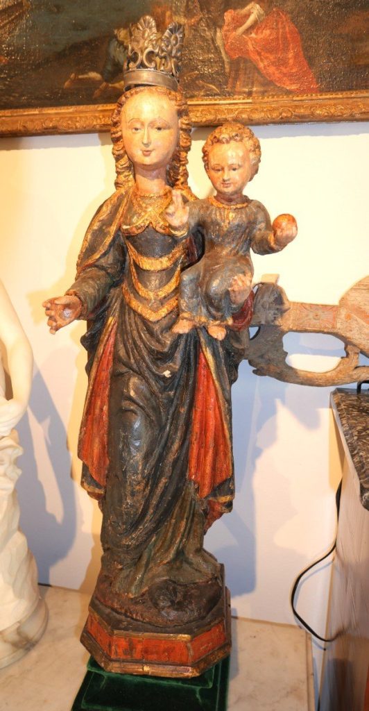 This polychrome wood sculpture is a Mechelen doll of the 17th century. A representation of the Virgin Mary and Christ child as Salvator Mundi. Presented by Antiquites Florentin.