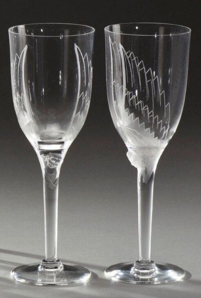 Profile and face view of the smiling angel champagne glass in pressed crystal glass by Marc Lalique.