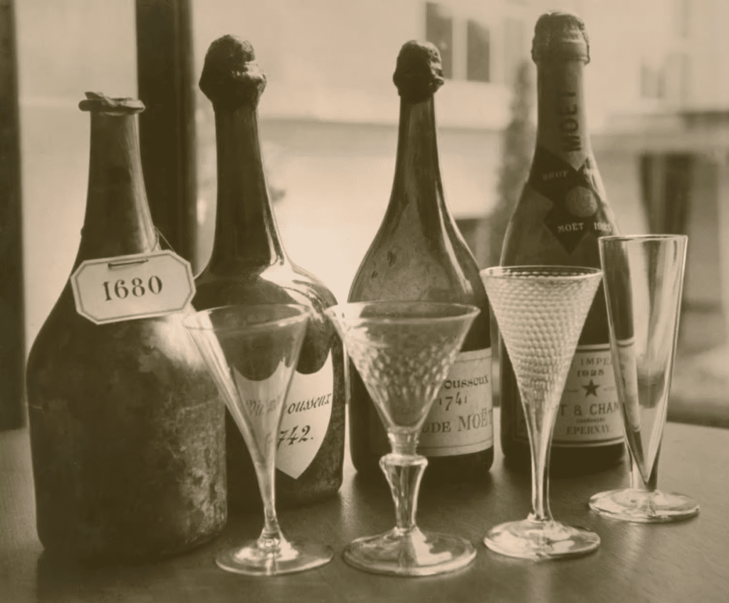 Old champagne glasses and Moët & Chandon bottles from 1680, 1741,1742, 1925. 