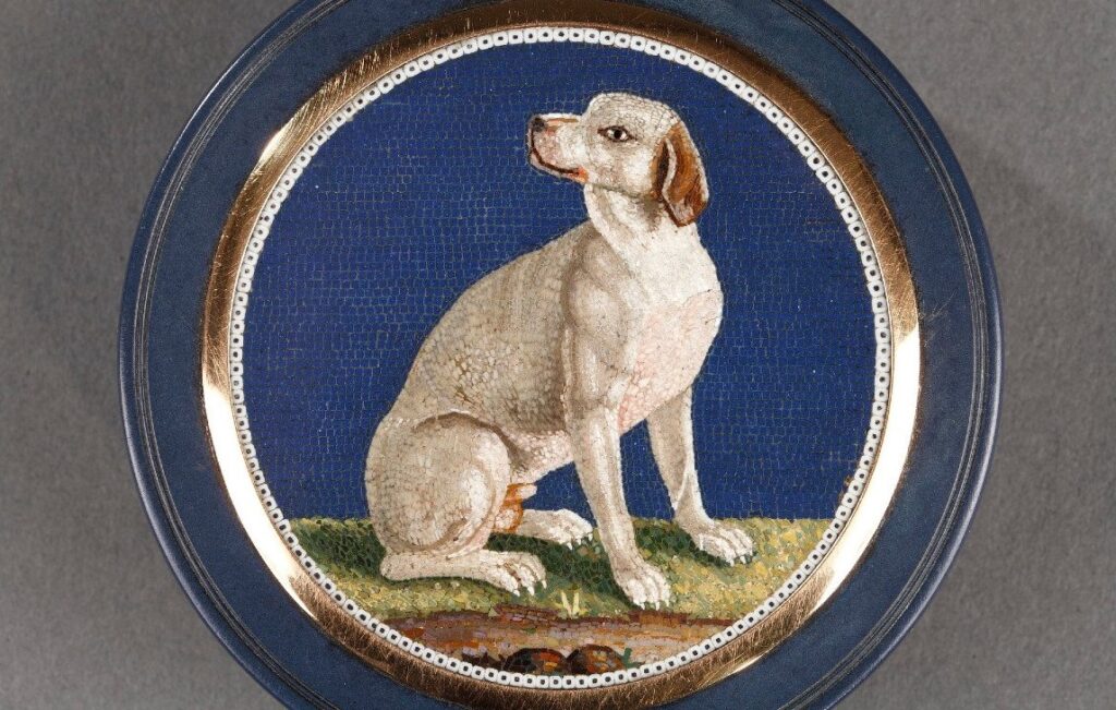 This dog in micromosaics boasts the distinctive style of Giacomo Raffaelli with predominant white tesserae, square ones for the bakground, rectilinear ones to outline the main motifs.