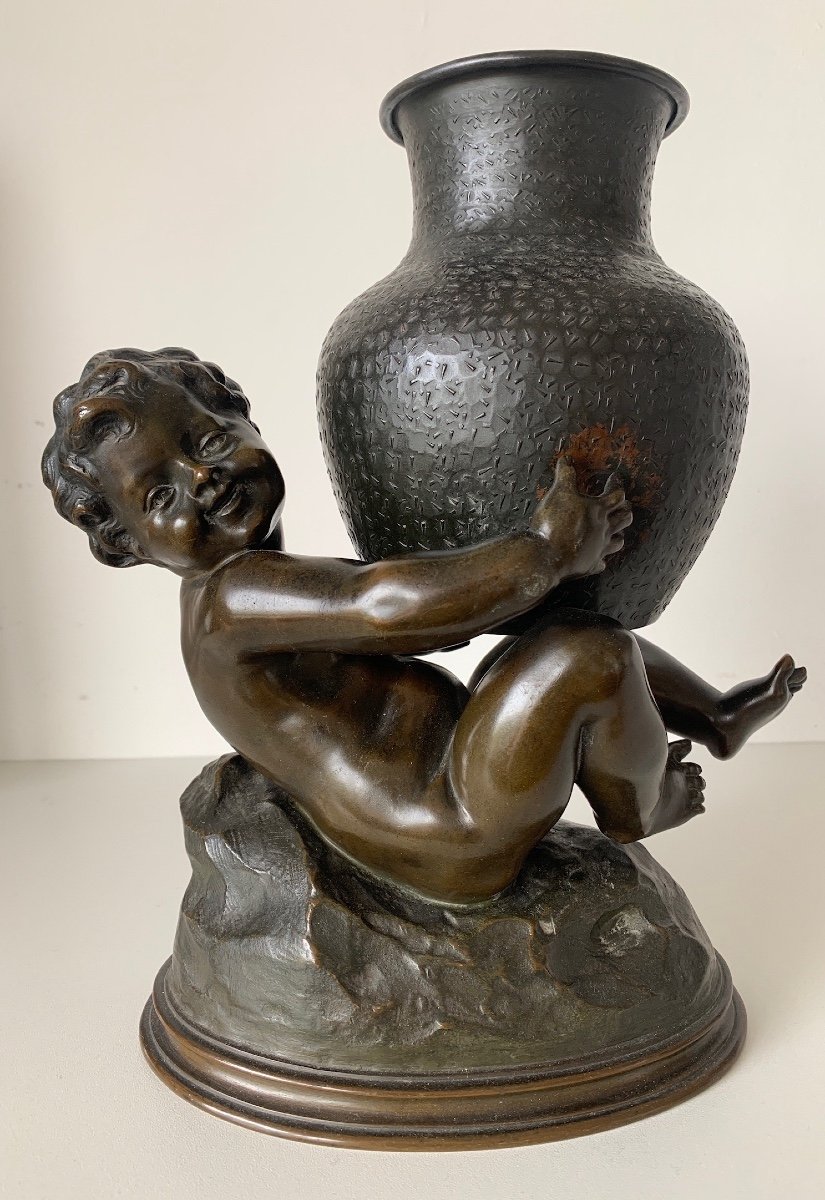 Bronze Subject Representing A Putto Holding A Jar