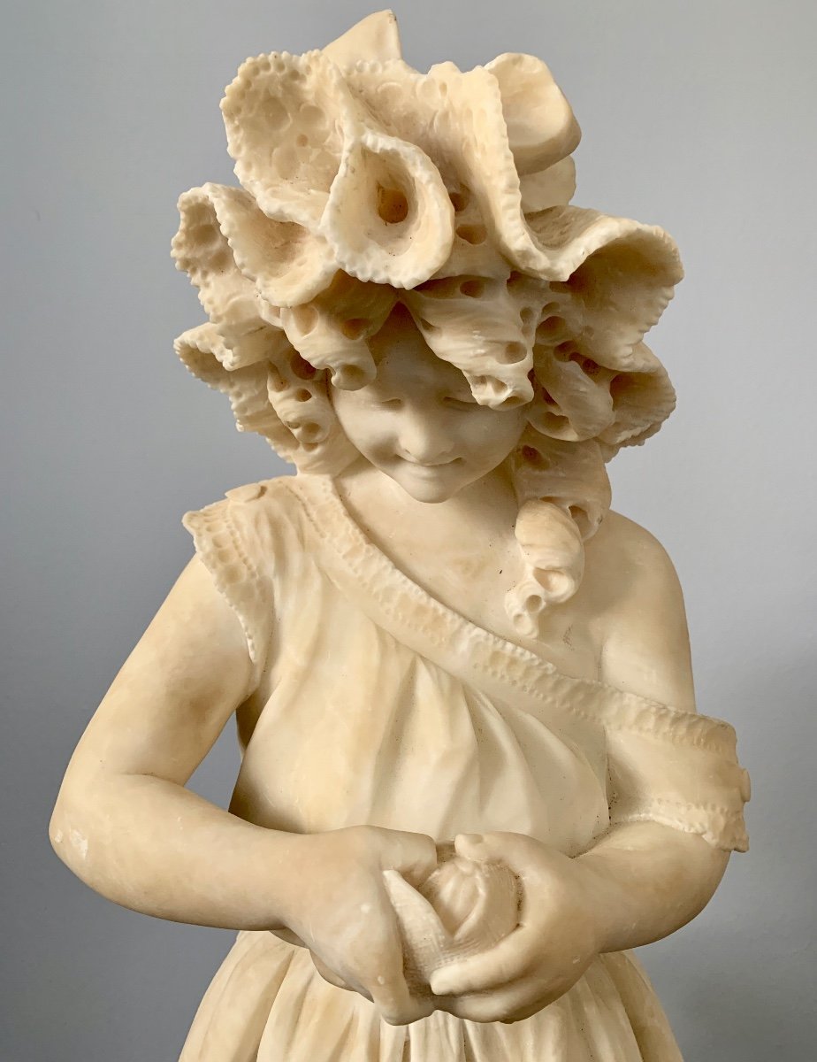 Young Girl With Clementine In Alabaster-photo-2