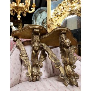 Pair Of Napoleon III Period Wall Consoles In Gilded Wood Decorated With Cherub Heads