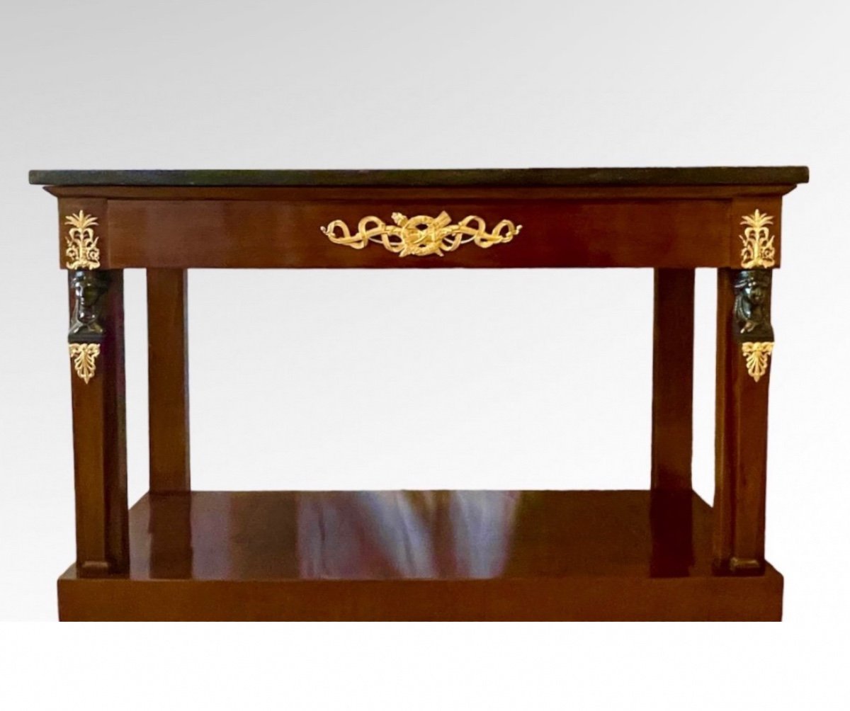 An Empire Ormolu-mounted Mahogany Console. Early 19th Century.