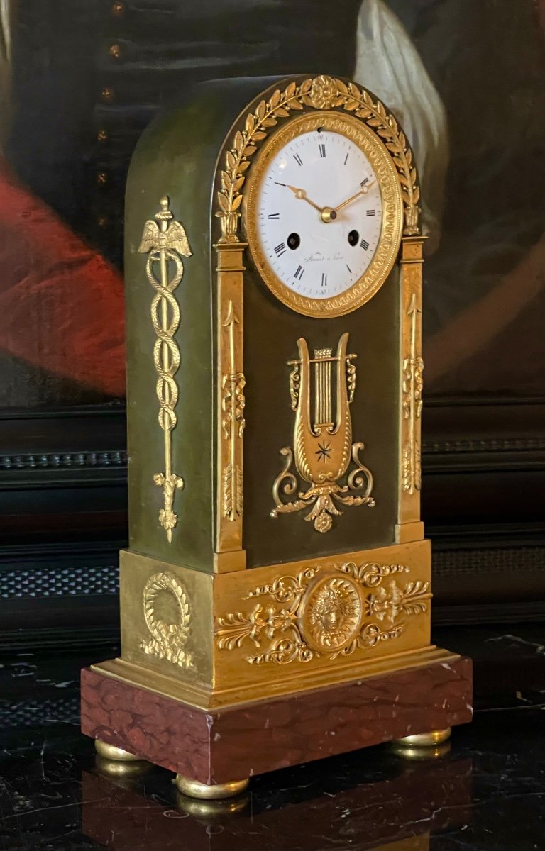 An Empire Gilt And Patinated Bronze Mantle Clock. Mesnil In Paris. 