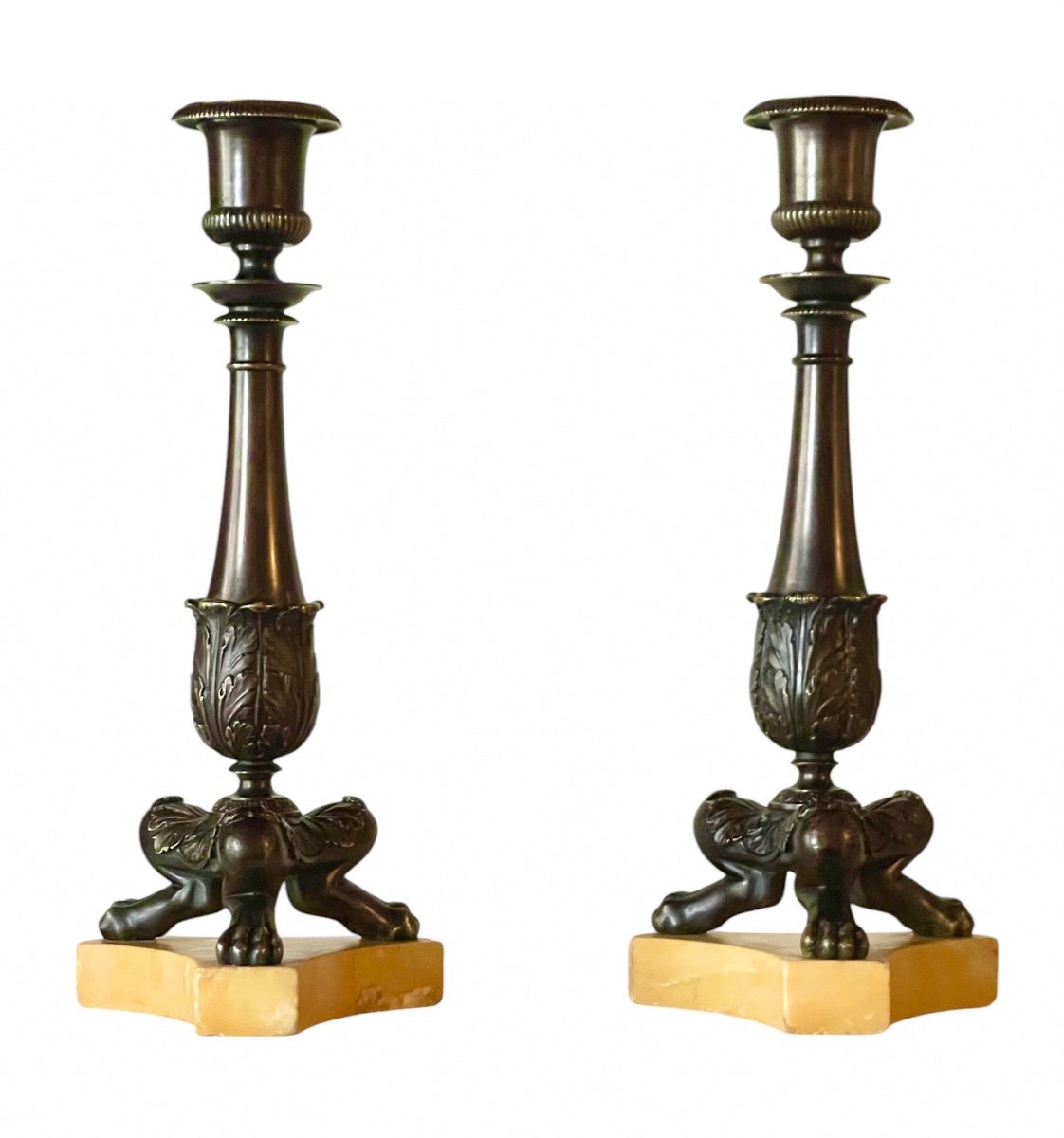 A Pair Of Restauration Patinated Bronze Tripod Candlesticks. Circa 1830. 