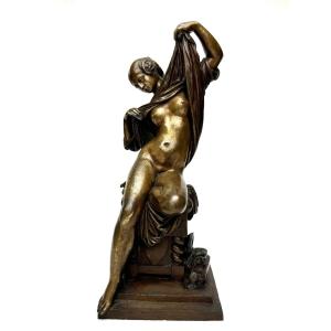 Bronze Sculpture Of A Seated Woman Undressing