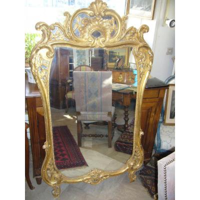 Grand miroir Louis XV en bois doré