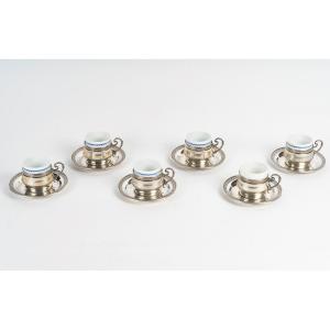 A Series Of Porcelain And Solid Silver Cups