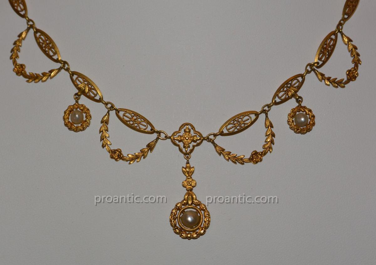 Collier draperie en or jaune 18 carats et perles vers 1910/1920