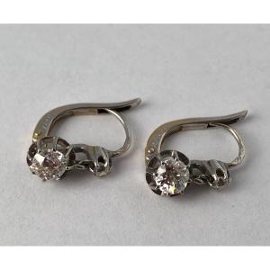 A Pair Of White Gold Earrings With Diamonds