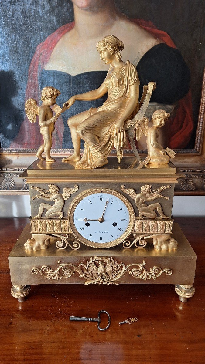 Empire Clock In Gilt Bronze. Venus, Cupid And Anteros. 