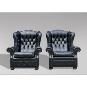 Pair Of Black Leather Wing Armchairs