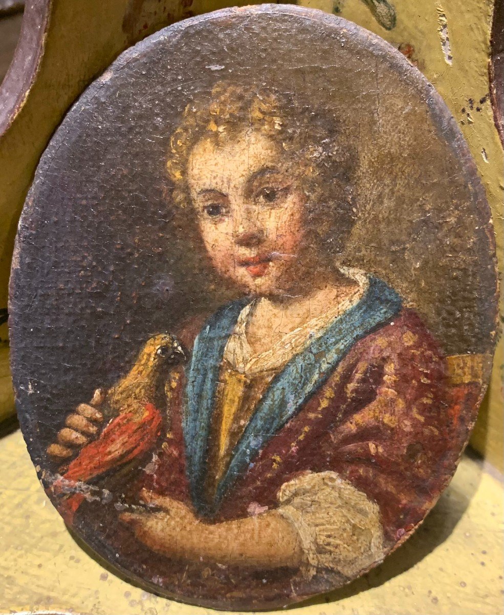 Portrait Of A Child Playing With A Bird.  Attributed To Antonio Amorosi (1660-1738)