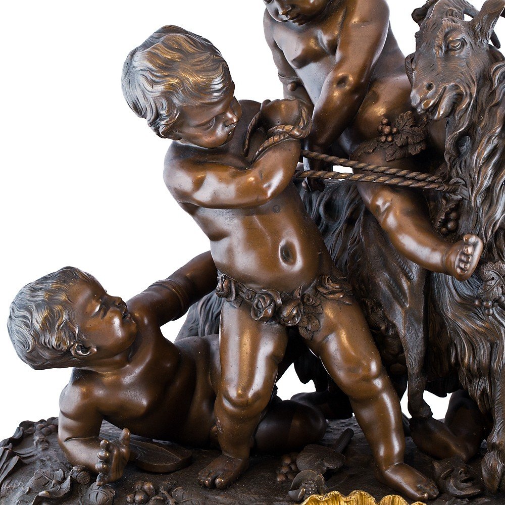 French Clock Depicting Cherubs Playing With A Goat-photo-1