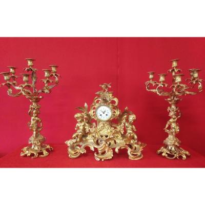 Clock And Pair Of Gilt Bronze Candlesticks