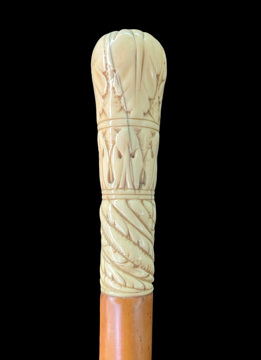 Walking Stick With Globular Ivory Knob Engraved With Stylised Plant Motifs. 