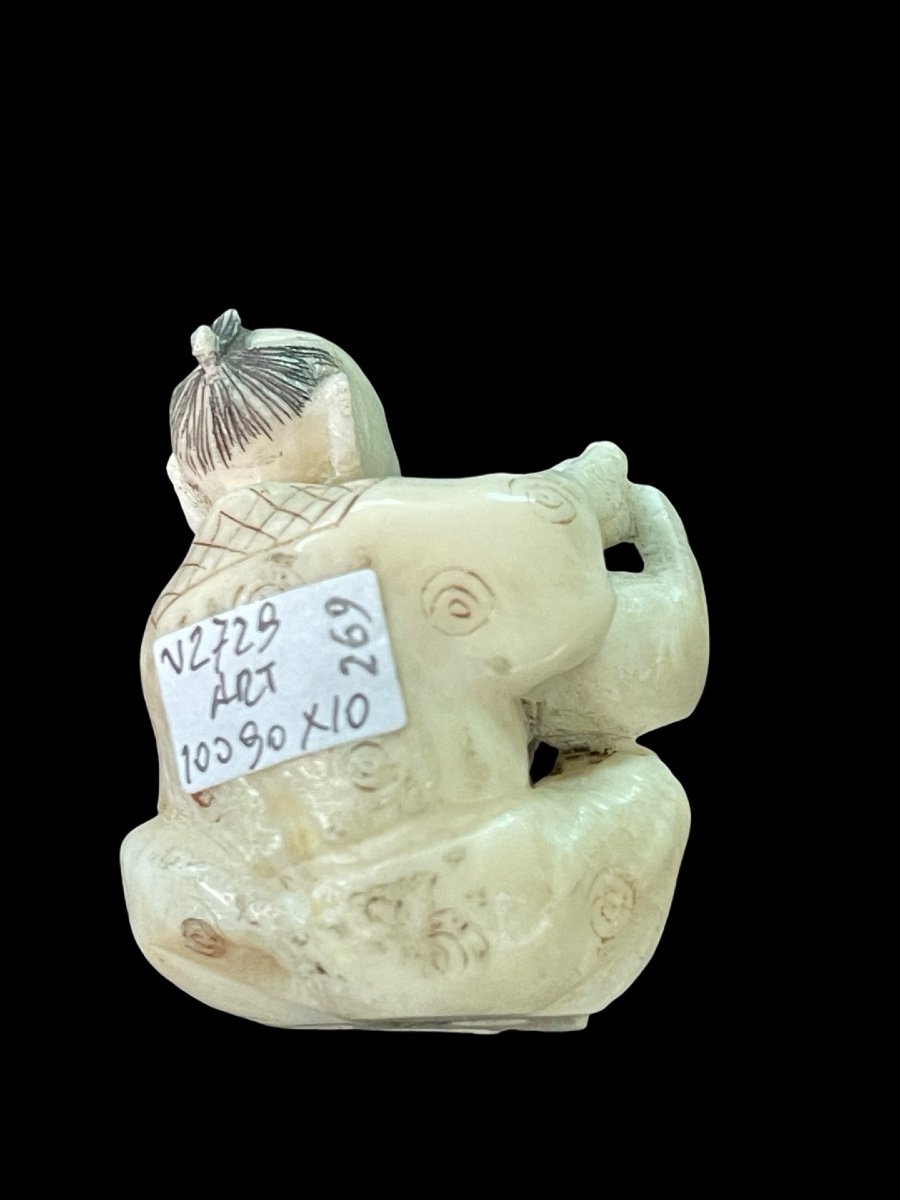 Ivory Netsuke Depicting A Seated Male Figure Pouring Tea. -photo-2