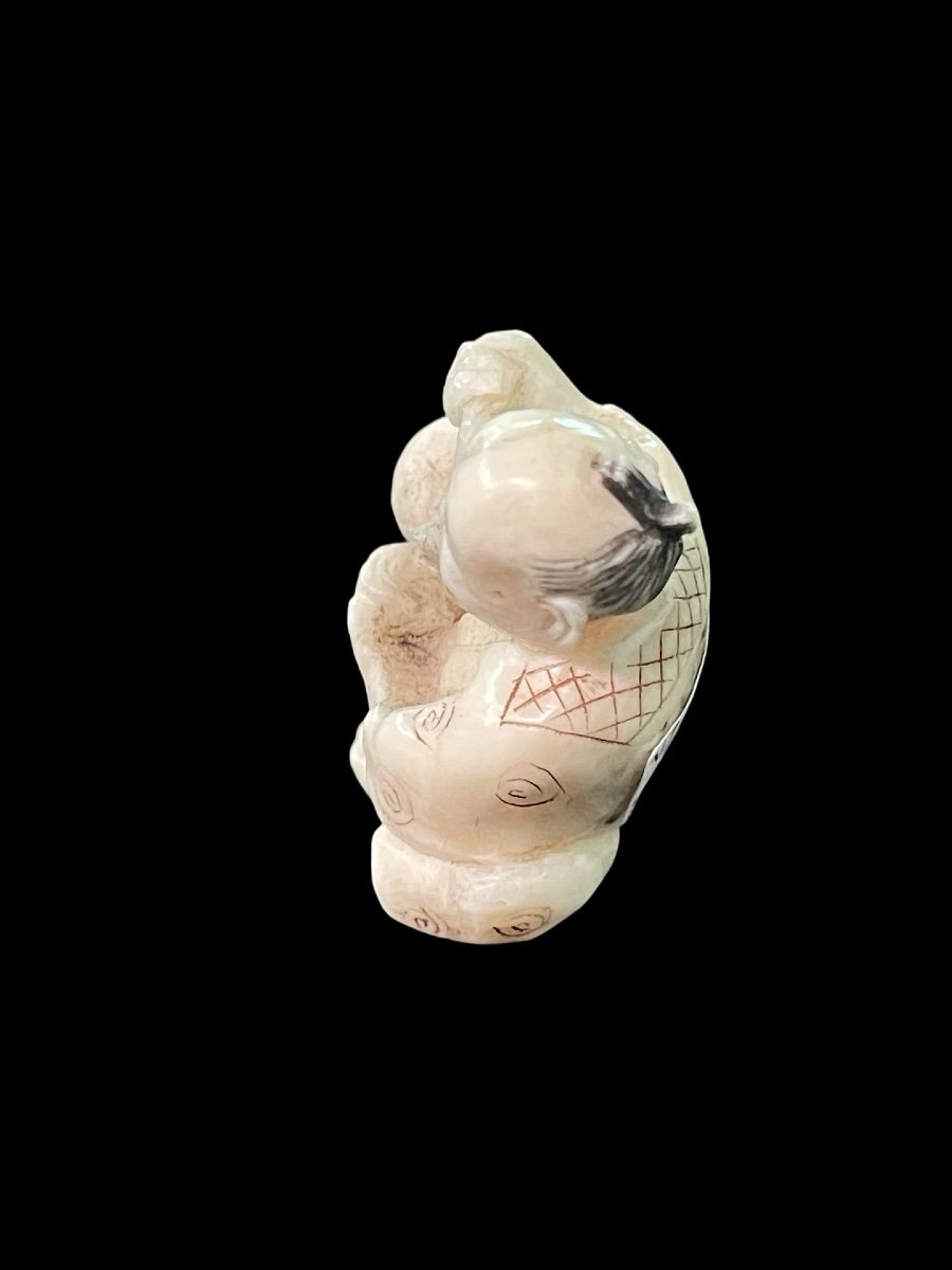 Ivory Netsuke Depicting A Seated Male Figure Pouring Tea. -photo-1