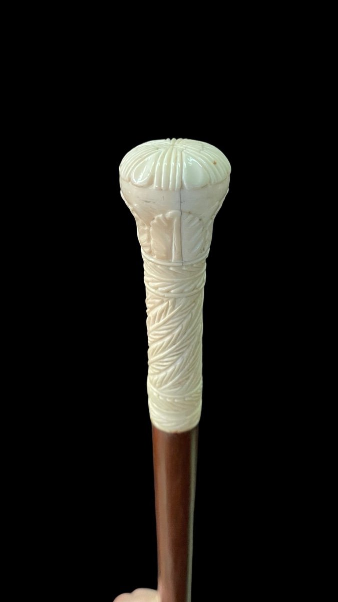 Walking Stick With Globular Knob Engraved With Stylised Plant And Geometric Motifs. 