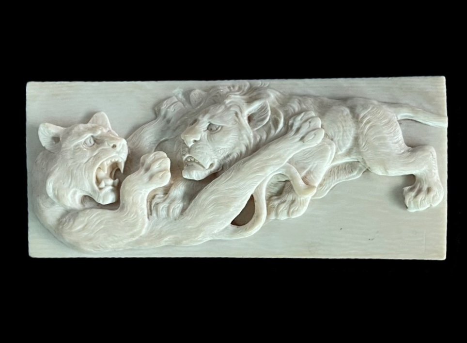 Ivory Bas-relief Plaque Depicting Two Fighting Lions. Japan. 