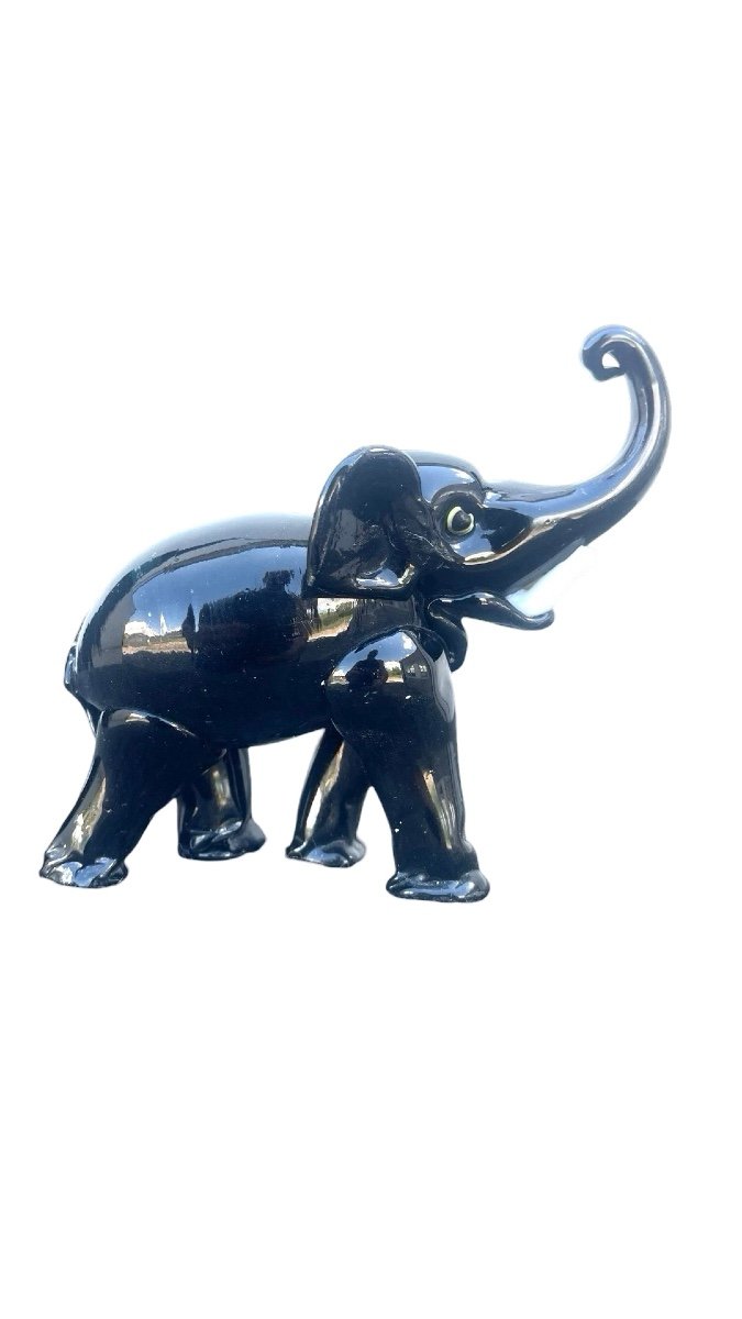 Black Glass Elephant With Milk Glass Tusks. Toso.