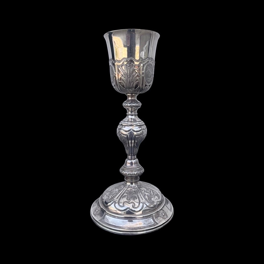 Embossed Silver Chalice With Globular Stem And Decoration With Religious And Plant Motifs. 