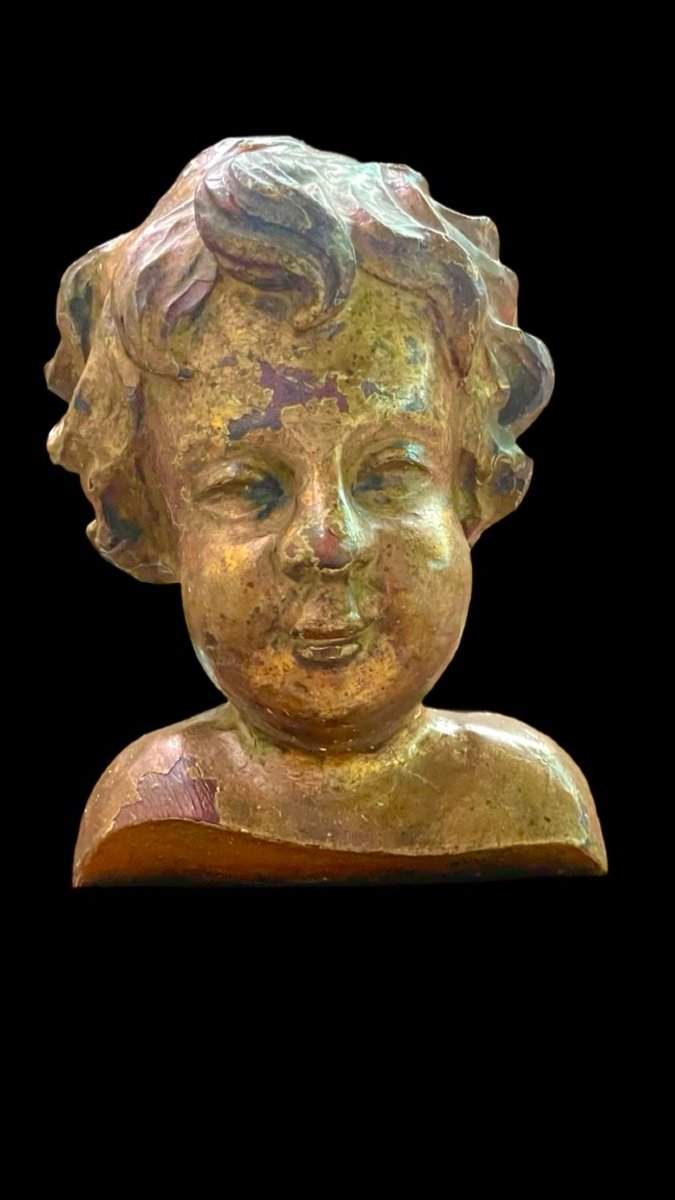 Bust Of A Child In Carved And Gilded Wood In Mecca Mounted On A Wooden Base. 