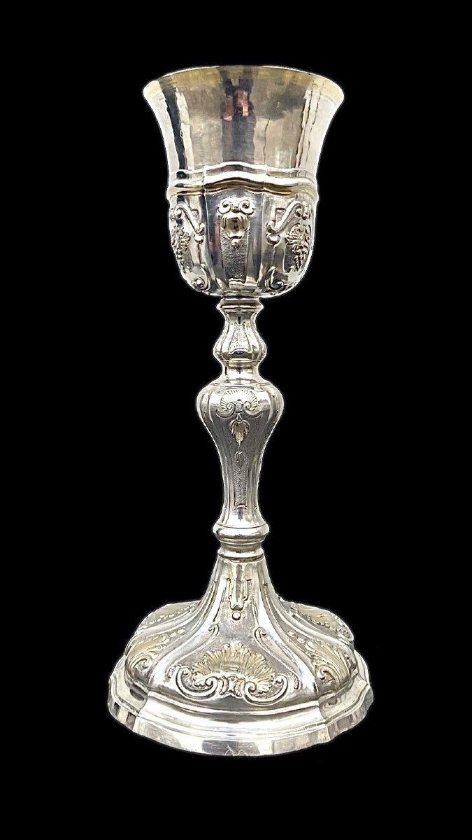 Embossed Silver Chalice With Tapered Globular Body With Grape Bunch And Rocaille Motifs. 