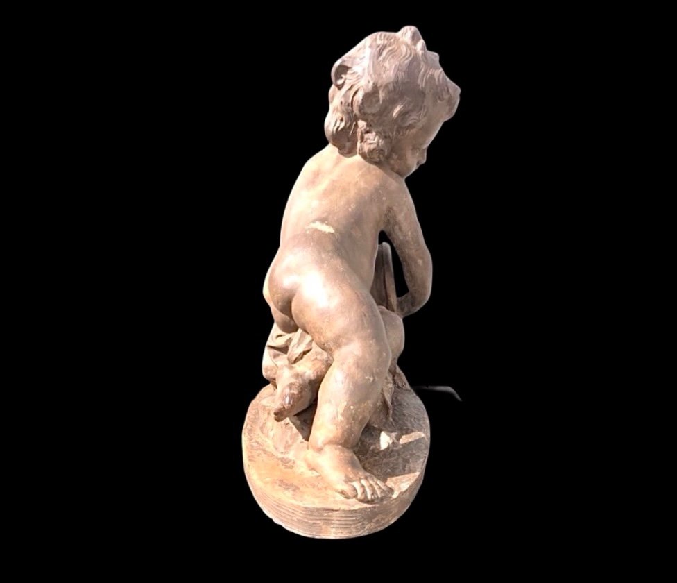 Terracotta Sculpture Depicting A Child Pouring Liquid From A Vase. -photo-3