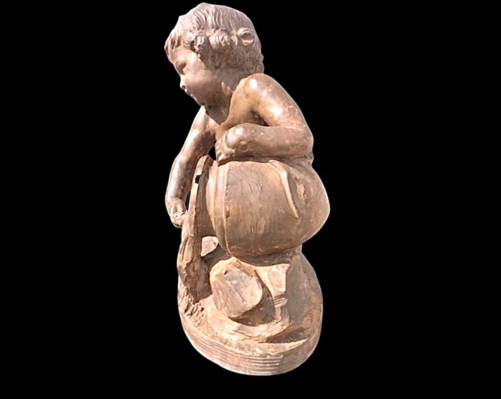 Terracotta Sculpture Depicting A Child Pouring Liquid From A Vase. -photo-4