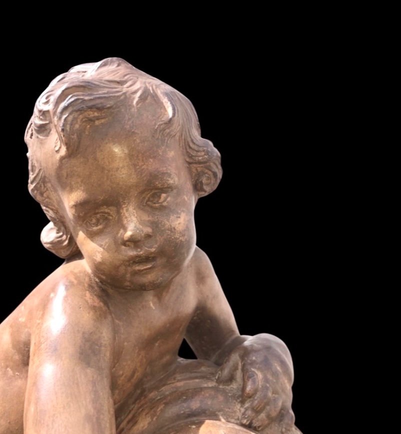 Terracotta Sculpture Depicting A Child Pouring Liquid From A Vase. -photo-1