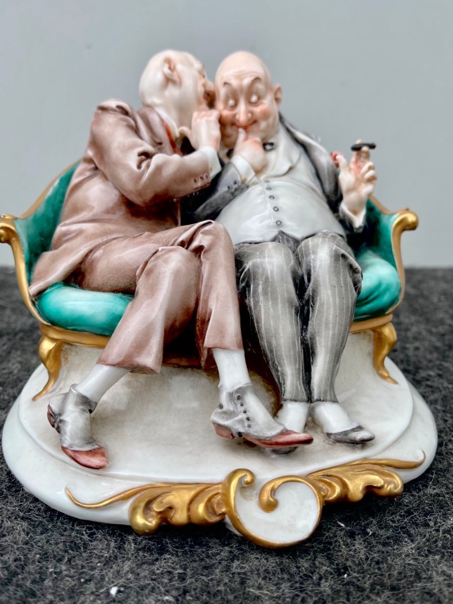 Caricature Porcelain Sculpture Depicting A Couple Of Friends Whispering To Each Other. 