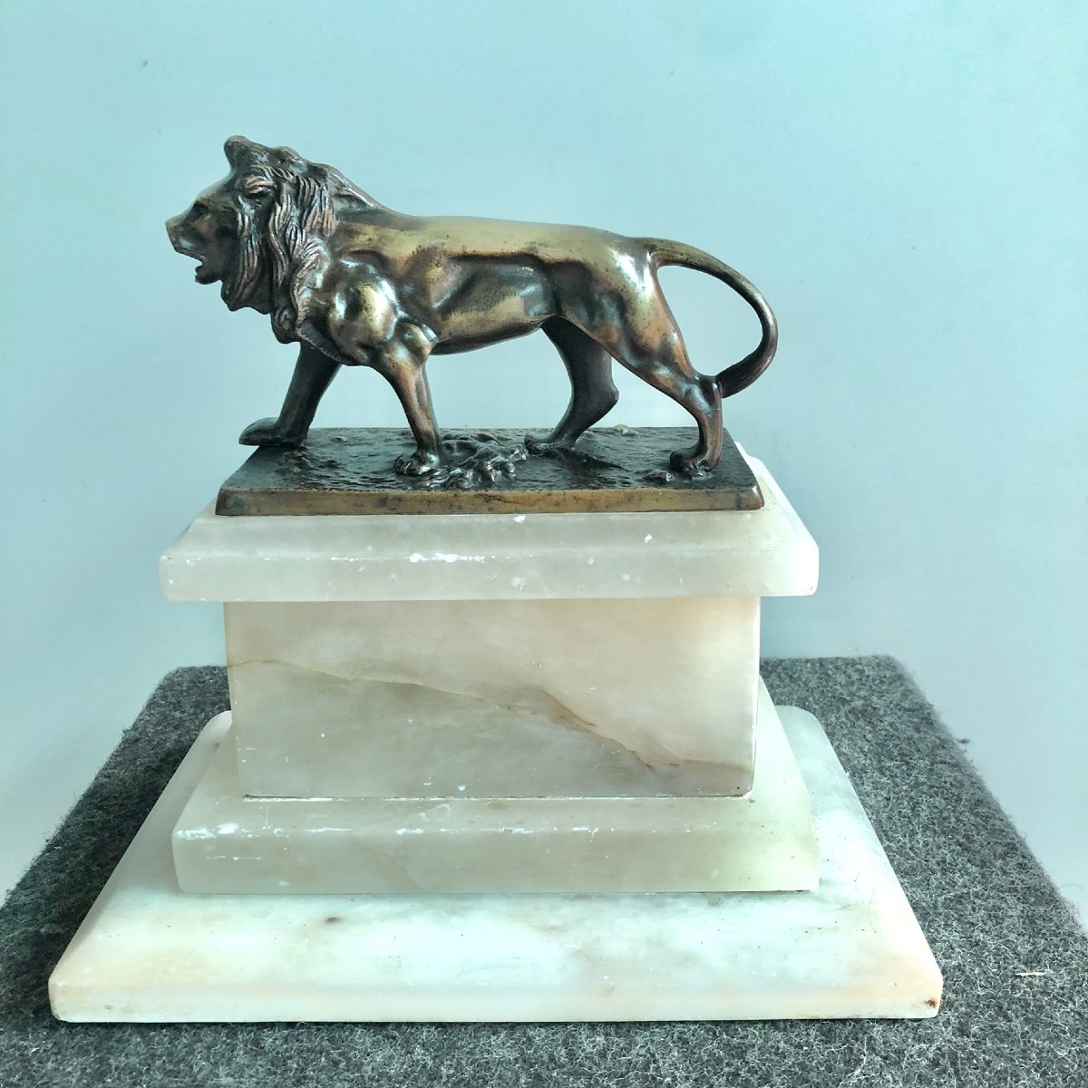 Bronze Lion On Alabaster Base.