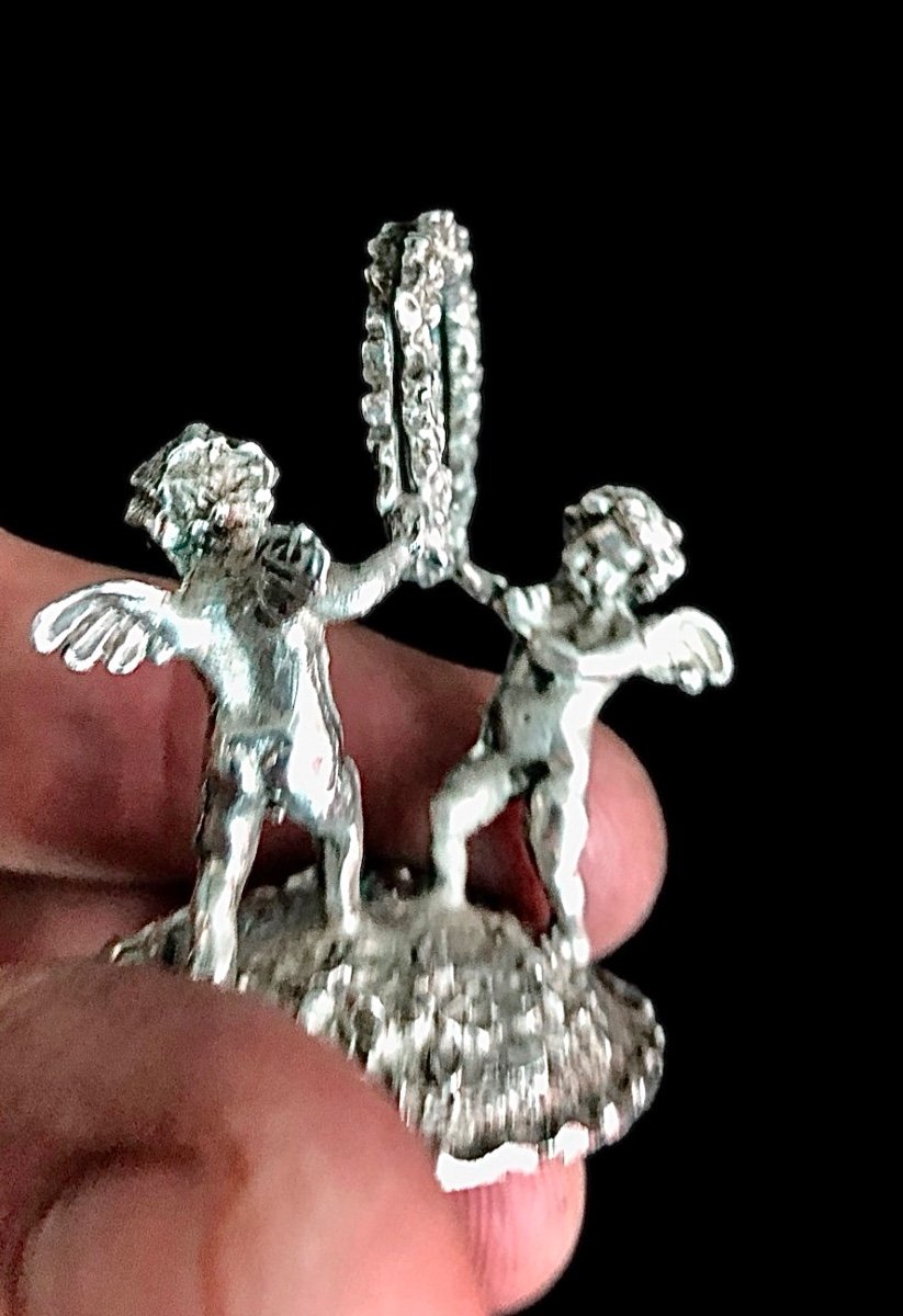 Set Of Six Silver Place Markers With A Pair Of Cherubs Holding A Garland. Im-photo-1