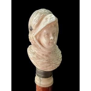 Stick With Ivory Knob Depicting The Bust Of A Child Disguised As A Bird. Walnut Wood Cane. 