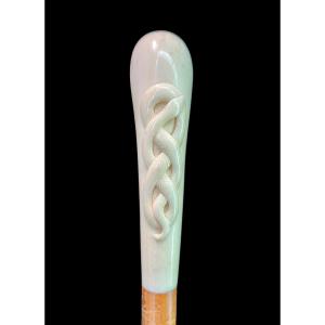 Stick With Globular Ivory Knob With Intertwined Snake Engraved In High Relief. 