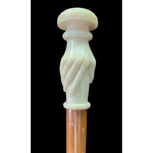 Walking Stick With Ivory Handle Depicting A Hand Holding A Knob. 