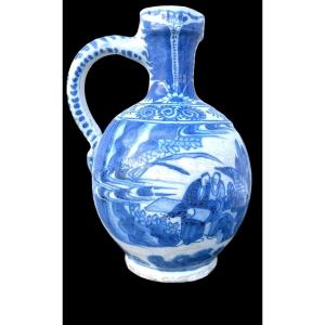 Blue Monochrome Majolica Jug With Pair Of Characters, Geometric And Stylised Plant Motifs. 