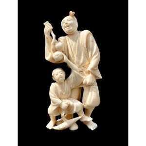 Ivory Okimono Sculpture With Male And Child Character. 