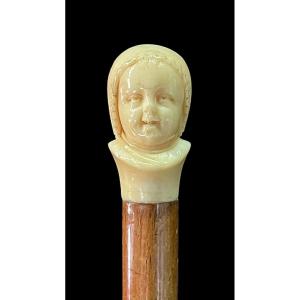 Walking Stick With Ivory Knob Depicting The Double Face Of A Laughing And Crying Child. 