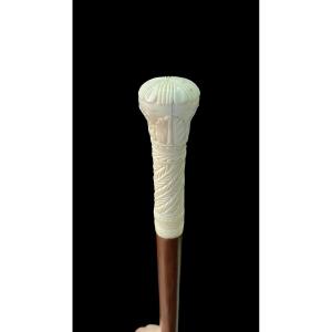 Walking Stick With Globular Knob Engraved With Stylised Plant And Geometric Motifs. 