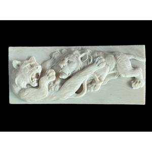 Ivory Bas-relief Plaque Depicting Two Fighting Lions. Japan. 