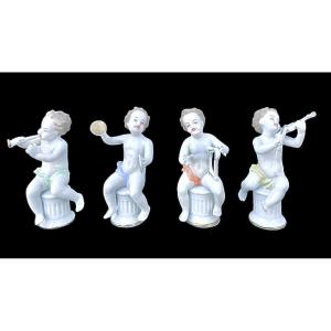 Series Of Four Porcelain Musician Cherubs Seated On Columns. 