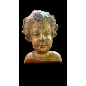 Bust Of A Child In Carved And Gilded Wood In Mecca Mounted On A Wooden Base. 