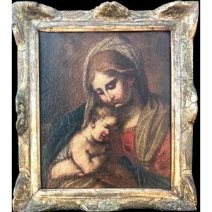 Peinture à l'huile sur toile représentant la Vierge à l'Enfant Jésus. 