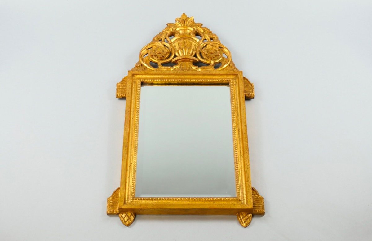 Louis XVI Style Gilded Wood Mirror With Pediment Decoration Of A Cup And Plants.