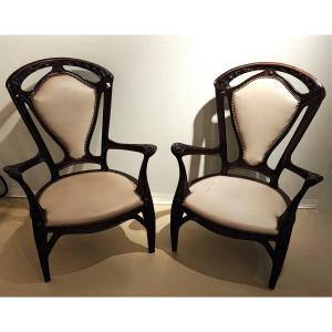 Exceptionnelle paire de fauteuils Gruber en acajou à décor de motifs floraux