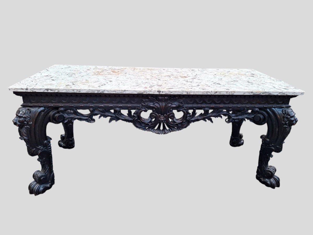 A Large, Highly Carved Console 